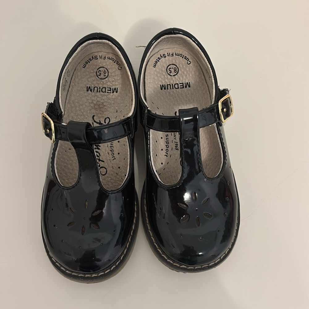 Black patent leather Mary Jane’s